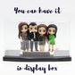 Family Figurines in Display Case
